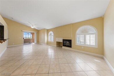 Unfurnished living room featuring light tile patte