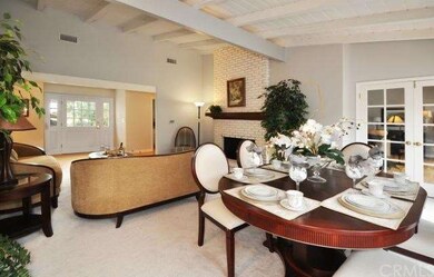 Living room/ Dining area with vaulted ceilings and