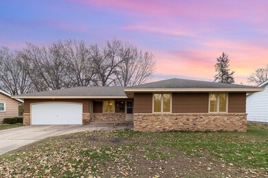 Note the covered porch from the garage to the front home entry