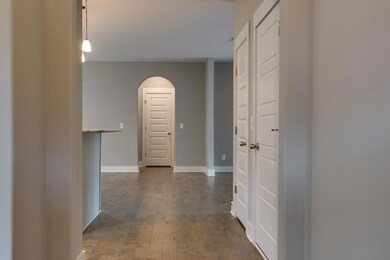 Continue straight through the foyer to the kitchen 