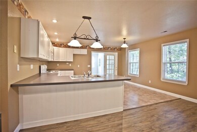 You can start cooking in this clean kitchen with lots of counter space!