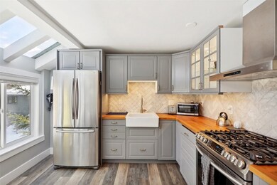 Kitchen with stainless steel appliances, butcher b