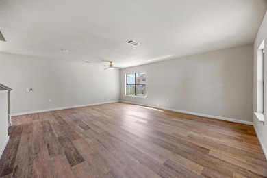 Empty room featuring visible vents, baseboards, c