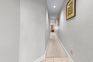 Hall with light colored carpet