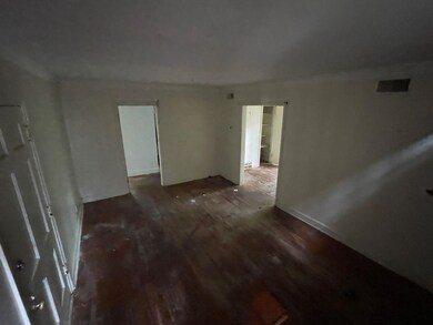 Unfurnished room with wood finished floors