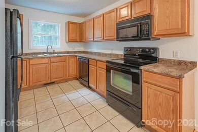 Freshly painted kitchen with tile floor and full appliance package!