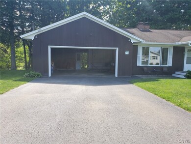 Attached garage opens up to the glorious back yard
