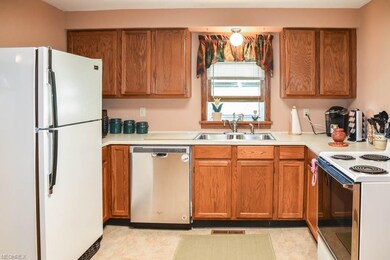 Eat-in kitchen with a new dishwasher.