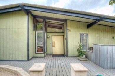 Wide custom built entry door with ample overhang t