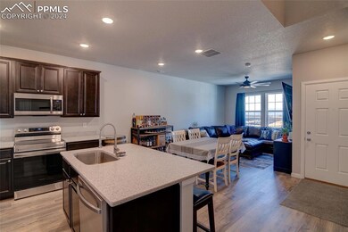Kitchen with light hardwood / wood-style flooring,
