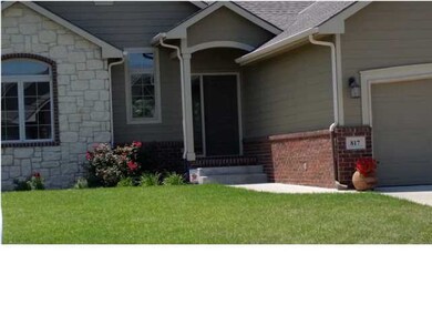 Nice Covered Entry With Stone and Brick Front