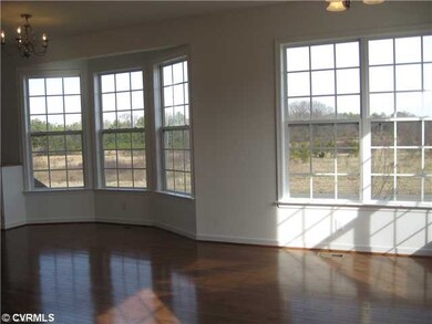 Dining Room - Bay Windows and Hardwood Floors