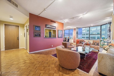 The wide front entry is just off the kitchen and l