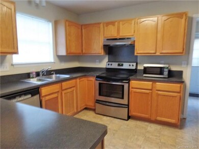 This kitchen has plenty of cabinets for storage. I