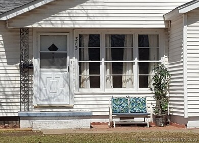 The decorative front porch area welcomes you to th