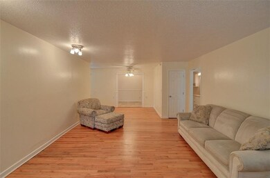 Large living room that is open to the dining area.