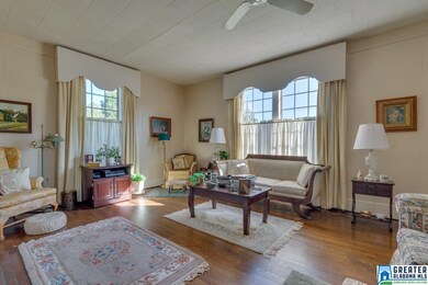 Three floor to ceiling windows allow that same lig