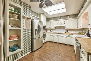 New subway tile backsplash, farmhouse sink, and butcher block counters.  Recent oven, dishwasher, microwave and cooktop.
