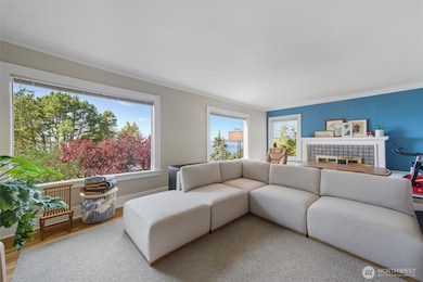 Unit B living room with new thermopane bay view windows.