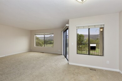 Large living room with expansive windows bringing 