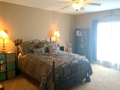 Beautiful roomy Master bedroom with large window and ceiling fan/light