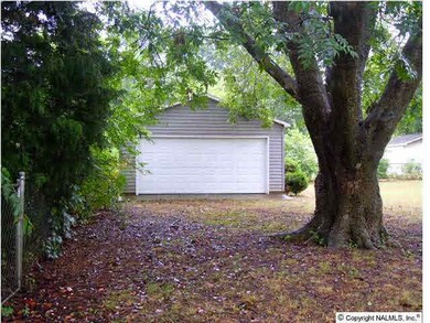 Detached garage with new garage door! Plenty of space and great workshop!