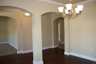 double arches and trey ceiling set off this room
