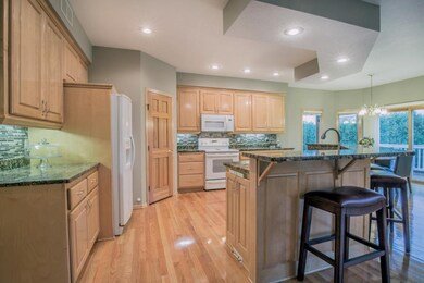 Kitchen with walk-in pantry and recessed lighting.