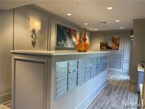Reception featuring mail area and recessed lightin