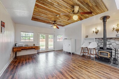 Living room featuring ceiling fan, french doors, w
