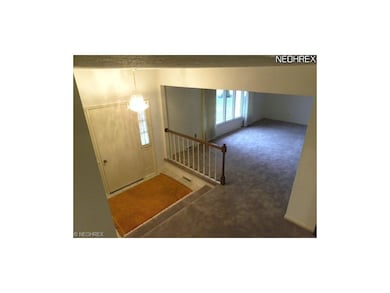 Ceramic tile foyer with coat closet for greeting g