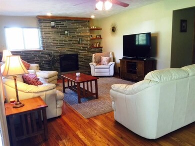 The warm hardwood floors greet you as you enter in