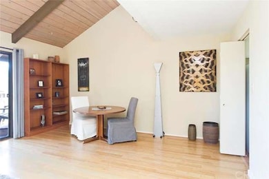 Dining area with living room and balcony access