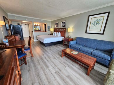 Bedroom featuring light wood-type flooring, a text