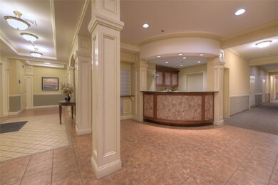Lobby desk and mail area with private gym at the e