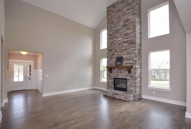 A look into your two story Great Room from your Kitchen & Casual Dining Room area!
