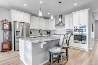 Spacious kitchen with an abundance of granite counter top island space