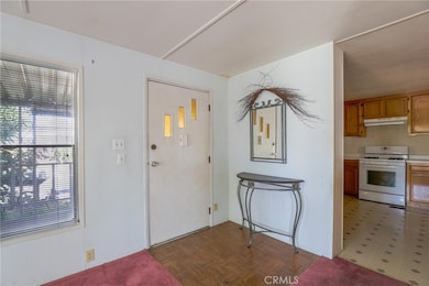 The home welcomes you inside with a parquet landing.