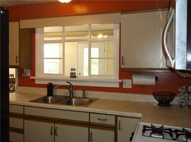 Another view of the kitchen window that opens to t