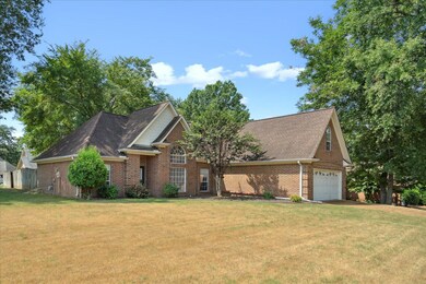 View of front of home featuring a garage and a fro