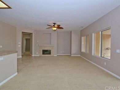 Great room with gas fireplace has been freshly pai