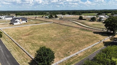 Birds eye view of property with a rural view