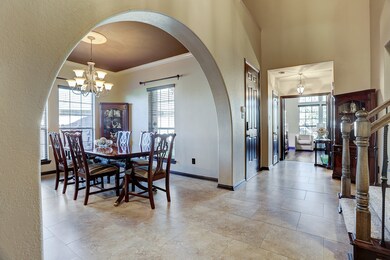 Notice the monumental arched entrance which allows a flowing feeling from the living room