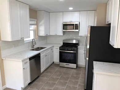 Kitchen with Quartz Countertops and Stainless Appliances