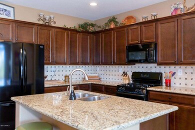 Granite with Travertine Backsplash