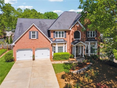 View of front of house featuring 3-side brick, dri