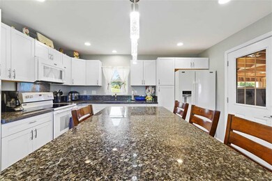 Granite countertops, shaker style cabinets, 12