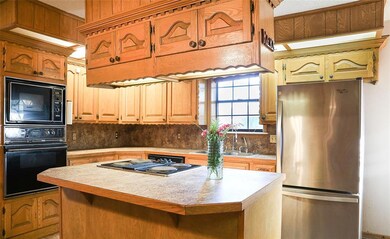Kitchen includes built in appliances, dishwasher a