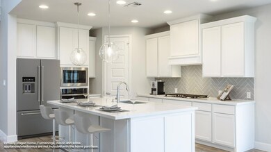Kitchen with appliances with stainless steel fini