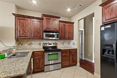 Granite countertops, lots of cabinets and counter space in kitchen.